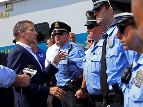 Missouri Gov. Eric Greitens speaks to St. Louis police officers following a news conference on Monday, July 10, 2017, in St. Louis. Greitens announced a plan Monday that calls for the Missouri State Highway Patrol to help patrol interstate highways in the city, targeting violent felons and saturating areas of high crime. (Christian Gooden/St. Louis Post-Dispatch via AP)