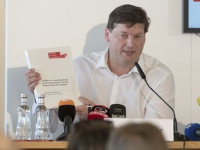 Ulrich Weber, a lawyer tasked with shedding light on the Regensburg Cathedral abuse case, speaks at a press conference at which the release of the final report on the case was announced in Regensburg, Germany, Tuesday, July 18, 2017. The  report has found that at least 547 members of a prestigious Catholic boys' choir in Germany were physically or sexually abused between 1945 and the early 1990s. Allegations involving the Domspatzen choir in Regensburg were among a spate of revelations of abuse by Roman Catholic clergy in Germany that emerged in 2010.  (Armin Weigel/dpa via AP)
