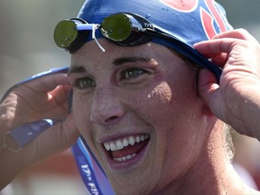 Ashley Twichell of the US smiles after winning the gold medal of a women's open water 5km final race of the FINA Swimming World Championships in Balatonfured, Hungary, Wednesday, July 19, 2017. (Zsolt Szigetvary/MTI via AP)