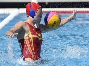 Goalie Lin Peng of China makes a save during the Brazil vs China women's water polo Group A first round match at the Swimming World Championships in Hajos Alfred National Swimming Pool in Budapest, Hungary, Sunday, July 16, 2017. (Balazs Czagany/MTI via AP)