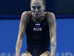 Nadezdha Bazhina of Russia competes in women's diving 1m springboard preliminary round of the FINA Swimming World Championships 2017 in Duna Arena in Budapest, Hungary, Friday, July 14, 2017. (Tibor Illyes/MTI via AP)