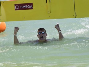 Ferry Weertman of the Netherlands celebrates after he won the gold medal in the men's open water 10km final of FINA Swimming World Championships 2017 in Balatonfured, 124 kms southwest of Budapest, Hungary, Tuesday, July 18, 2017. (Zsolt Szigetvary/MTI via AP)