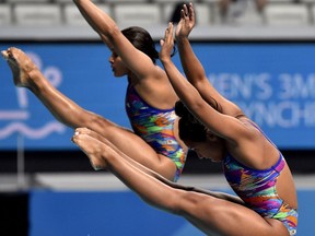 Chavez Munoz and Hernandez Torres of Mexico compete in the women's 3m synchro springboard final of the 17th FINA Swimming World Championships in Duna Arena in Budapest, Hungary, Monday, July 17, 2017. (Zoltan Mathe/MTI via AP)
