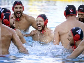 Canadian players cheer  during the men's water polo Group A third round match between Brazil and Canada, at the 17th FINA Swimming World Championships in Hajos Alfred National Swimming Pool in Budapest, Hungary, Friday, July 21, 2017. (Szilard Koszticsak/MTI via AP)