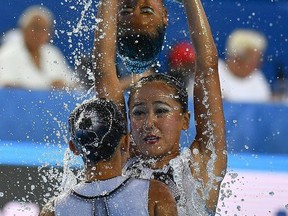 Members of Team Macau perform during the Women's Free Combination Synchronized Swimming Preliminary Free Combination of the 17th FINA World Championships 2017 in Budapest, Hungary, Thursday, July 20, 2017. (Zsolt Czegledi/MTI via AP)