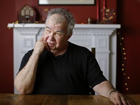 In this June 20, 2017, photo, John Prine poses in his office in Nashville, Tenn. The former Chicago mailman has become an affable songwriting guru for many of Nashville's talented young artists and his songbook, "Beyond Words," released in April, features guitar chords, family photos, handwritten lyrics and witty stories alongside some of his best known songs, such as "Sam Stone." (AP Photo/Mark Humphrey)