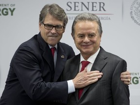 U.S Energy Secretary Rick Perry embraces Mexico's Secretary of Energy Pedro Joaquin Coldwell, after they made a joint statement in Mexico City, Thursday, July 13, 2017. (AP Photo/Eduardo Verdugo)