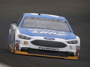 Race driver driver Ryan Blaney (21) drives through the first turn during practice for the NASCAR auto race at Indianapolis Motor Speedway, in Indianapolis Saturday, July 22, 2017. (AP Photo/Michael Conroy)