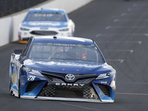 Martin Truex Jr. (78) drives into turn one during the NASCAR Brickyard 400 auto race at Indianapolis Motor Speedway in Indianapolis, Sunday, July 23, 2017. (AP Photo/Darron Cummings)