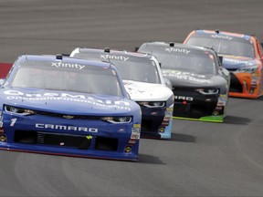 Race driver Elliott Sadler (1) leads the field during the NASCAR Xfinity auto race at Indianapolis Motor Speedway, in Indianapolis Saturday, July 22, 2017. (AP Photo/Darron Cummings)