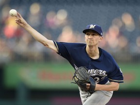 Milwaukee Brewers starting pitcher Zach Davies delivers a pitch during the first inning of a baseball game against the Washington Nationals, Tuesday, July 25, 2017, in Washington. (AP Photo/Nick Wass)