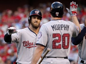 Washington Nationals' Bryce Harper, left, is congratulated by teammate Daniel Murphy (20) after hitting a two-run home run during the first inning of a baseball game St. Louis Cardinals, Sunday, July 2, 2017, in St. Louis. (AP Photo/Jeff Roberson)