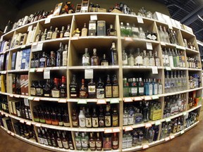 FILE - This June 16, 2016, file photo, taken with a fisheye lens, shows bottles of alcohol during a tour of a state liquor store, in Salt Lake City. Higher liquor prices and other changes under a broad new Utah liquor law will take effect Saturday, July 1, 2017, along with a highway funding bill and a test program allowing people convicted of drunken driving to avoid having their driver's license suspended. (AP Photo/Rick Bowmer, File)