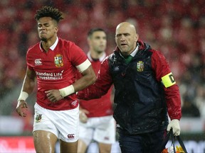 Lions winger Anthony Watson leaves the field for a concussion test during the second rugby test between the British and Irish Lions and the All Blacks in Wellington, New Zealand, Saturday, July 1, 2017. (AP Photo/Mark Baker)