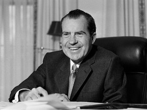 This Jan. 21, 1969 file photo shows President Richard Nixon at his desk at the White House in Washington. Many comparisons can be made between Nixon and Trump's presidency.