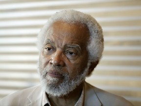 In this June 28, 2017 photo, Junius Williams talks to a reporter about the the Newark riots of 1967 in Newark, N.J. Fifty years ago Williams was a law student at Yale University fighting gentrification in Newark when the riots broke out. As he was driving friends home on the second night of the riots, Williams faced down a police officer wielding a shotgun during a traffic stop. He was spared, he says, when a sergeant diffused the situation by searching Williams' car for guns. He found only law books.  (AP Photo/Seth Wenig)