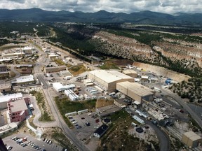 FILE - This undated file aerial photo shows the Los Alamos National laboratory in Los Alamos, N.M. Employees have been fired and other personnel actions have been taken at the laboratory after small amounts of radioactive material were mistakenly shipped aboard a commercial cargo plane. (The Albuquerque Journal via AP, File)