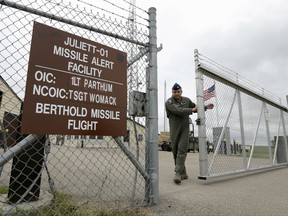 FILE - In this June 24, 2014 file photo, a gate is closed at an ICBM launch control facility in the countryside outside Minot, N.D., on the Minot Air Force Base. The Pentagon has thrown a cloak of official secrecy over assessments of how safely and securely its nuclear weapons are operated, maintained and guarded, closing a window onto an already obscure part of the military with a history of periodic inspection failures and lapses in morale. (AP Photo/Charlie Riedel, File)