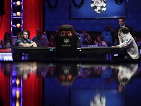 Scott Blumstein, left, and Dan Ott compete at the World Series of Poker main event, Saturday, July 22, 2017, in Las Vegas. (AP Photo/John Locher)