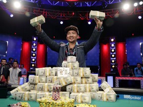 FILE - In this Nov. 2, 2016, file photo, Qui Nguyen poses for photographers after winning the World Series of Poker Main Event in Las Vegas. The premier poker tournament begins Saturday in Las Vegas. (AP Photo/John Locher, File)