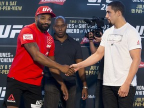 Yoel Romero, left, and Robert Whittaker pose during media day for Saturday's UFC 213, in Las Vegas on Thursday, July 6, 2017. (Erik Verduzco/Las Vegas Review-Journal via AP)