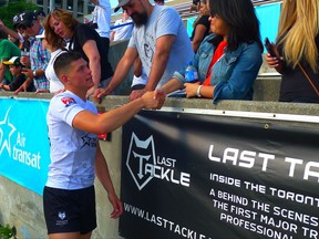 Victoria teenager Quinn Ngawati, who became the first Canadian-born player to appear for the Toronto Wolfpack, greets fans after their game against the Gloucestershire All Golds in Kingstone Press League 1 rugby action in Toronto on Saturday, July 8, 2017. THE CANADIAN PRESS/Neil Davidson
