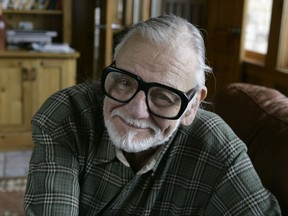 FILE - In this Monday, Jan. 21, 2008 file photo, director and writer George Romero poses for a photograph while talking about his film "Diary of the Dead' at the Sundance Film Festival in Park City, Utah. George Romero, whose classic "Night of the Living Dead" and other horror films turned zombie movies into social commentaries and who saw his flesh-devouring undead spawn countless imitators, remakes and homages, has died. He was 77. Romero died Sunday, July 16, 2017 following a battle with lung cancer. (AP Photo/Amy Sancetta, File)