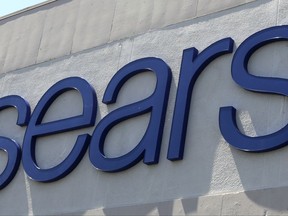 FILE - In this  May 11, 2017, photo shows a Sears store in Hialeah, Fla.  Sears is looking to get a hand from Amazon, announcing that it will start offering its Kenmore products on the online powerhouse's website. Sears, which runs Kmart and its namesake stores, said that Kenmore Smart appliances will also be fully integrated with Amazon's Alexa. This will allow consumers to control products, like Kenmore Smart air conditioners, by making a request to Alexa. Shares of Sears Holdings, based in Hoffman Estates, Illinois, surged more than 8 percent in Thursday, July 20, premarket trading.  (AP Photo/Alan Diaz)