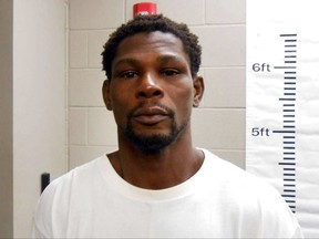 This booking photo released by the Maumelle Police Department shows Jermain Taylor. Police in the Little Rock suburb of Maumelle, Ark., say Taylor 38, and a former middleweight boxing champion, was arrested at his home around 3 a.m. Tuesday after allegedly biting a woman's arm and face and threatening to kill her.  He was later released. Taylor  is currently serving a six-year suspended sentence after pleading guilty to nine felony charges in 2015, including a shooting that critically wounded his cousin, Tyrone DaWayne Hinton.. (Maumelle Police Department via AP)