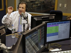 FILE - In this Monday, Feb. 3, 2014 file photo, New Jersey Gov. Chris Christie sits in a studio during his radio program, "Ask the Governor" in Ewing, N.J. New Jersey Gov. Chris Christie is getting his shot to replace New York's dean of sports talk radio. A spokeswoman for WFAN radio told The Record that Christie's appearances Monday and Tuesday afternoons for Mike Francesca are audition days, Friday, July 7, 2017. (AP Photo/Mel Evans, Pool, File)