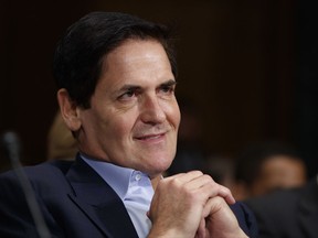 FILE - In this Wednesday, Dec. 7, 2016 file photo, AXS TV Chairman and Dallas Mavericks owner Mark Cuban listens on Capitol Hill in Washington while testifying before a Senate Judiciary subcommittee hearing on the proposed merger between AT&T and Time Warner. President Donald Trump's performance in the White House is making it harder for Republicans and billionaires in the coming elections. That's according to two prominent Trump critics, billionaire businessman Mark Cuban and former Florida Gov. Jeb Bush, who lashed out at the GOP president Saturday, July 22, 2017 during a summer festival in New York City. (AP Photo/Evan Vucci, File)
