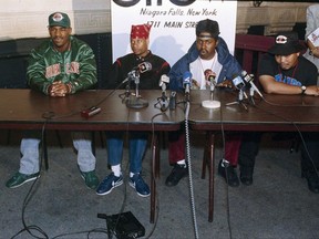 FILE - In this Oct. 3, 1990, file photo, 2 Live Crew member Mr. Mixx (David Hobbs), second from right, speaks to reporters at the Late Show night club in Niagara Falls, N.Y., while being joined by fellow group members, J.T. Money, left, Brother Marquis, second from left; and Fresh Kid Ice, right. Christopher Wong Won, known as Fresh Kid Ice and a founding member of the Miami hip-hop group 2 Live Crew has died Thursday, July 13, 2017, at a Veterans Affairs hospital in Miami as a result of "medical conditions" he had suffered for several years, the group's manager, DJ Debo, said. He was 53.  (AP Photo/Mike Groll, File)