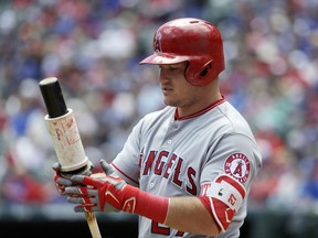 FILE - In this April 30, 2017, file photo, Los Angeles Angels' Mike Trout waits on deck for his at-bat against the Texas Rangers during a baseball game in Arlington, Texas. The two-time AL MVP is set to return to the Angels' lineup Friday after missing 39 games because of a torn ligament in his left thumb. Los Angeles opens the unofficial second half against Tampa Bay, which took three of four from Boston before the All-Star break to get within 3 1/2 games of the AL East lead. (AP Photo/Tony Gutierrez, File)