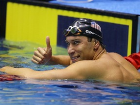 FILE - In this Friday, June 30, 2017 file photo, Matt Grevers celebrates winning the men's 100-meter backstroke at the U.S. swimming national championships in Indianapolis. Matt Grevers and Elizabeth Beisel have been through this before. But they're still walking around the deck of the glittering Duna Arena in Budapest, Hungary looking a big wide-eyed, as if they can't quite believe they're here for another world championships, Saturday, July 22, 2017. (AP Photo/Michael Conroy, File)
