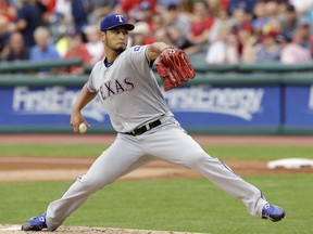 FILE - In this June 28, 2017, file photo, Texas Rangers starting pitcher Yu Darvish delivers in the first inning of a baseball game against the Cleveland Indians, in Cleveland. Yu Darvish could be going into his final stretch with the Rangers. The right-hander from Japan can become a free agent after this season. (AP Photo/Tony Dejak, File)