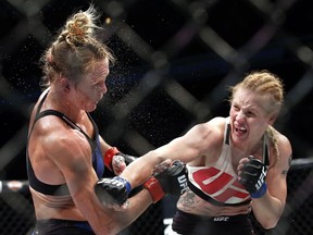 FILE - In this July 23, 2016, file photo, Valentina Shevchenko, right, of Kyrgyzstan, follows through on a punch to Holly Holm during a women's bantamweight mixed martial arts bout in Chicago. Shevchenko is a Soviet-born Peruvian from Kyrgyzstan who does her mixed martial arts training in Thailand and the U.S. This avid traveler, dance contest winner and recent restaurant shooting survivor also might be the UFC's new bantamweight champion after her rematch with Amanda Nunes on Saturday, July 8, 2017. (AP Photo/Nam Y. Huh, File)