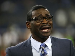 FILE - In this Sept. 1, 2016, file photo, broadcast personality and former Dallas Cowboys player Michael Irvin talks with people on the field before a preseason NFL football game between the Cowboys and Houston Texans, in Arlington, Texas. Prosecutors say there's insufficient evidence to file sexual assault charges against Michael Irvin, a former football star for the Dallas Cowboys and the University of Miami. A 27-year-old woman accused Irvin of drugging and sexually assaulting her at the W Hotel in Fort Lauderdale in March. (AP Photo/Ron Jenkins, File)