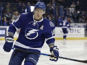 FILE - In this Thursday, Feb. 2, 2017 file photo, Tampa Bay Lightning left wing Ondrej Palat (18), of the Czech Republic, warms up before an NHL hockey game against the Ottawa Senators in Tampa, Fla. A person with direct knowledge of the move says the Tampa Bay Lightning have agreed to terms with left winger Ondrej Palat on a $26.5 million, five-year deal. he person spoke to The Associated Press on condition of anonymity Friday, July 14, 2017 because it had not been announced. (AP Photo/Chris O'Meara)