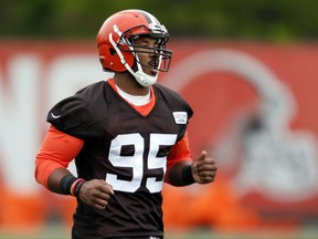 FILE - In this May 12, 2017 photo shows Cleveland Browns' Myles Garrett runs through drills during NFL football rookie minicamp in Berea, Ohio. Garrett has fully recovered from a foot sprain and is ready for training camp, the team announced Wednesday, July 26, 2017. Garrett, the No. 1 overall pick in this year's draft, suffered a left lateral foot sprain during minicamp in June.  (AP Photo/Ron Schwane, File)