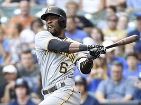 FILE - In this Aug. 27, 2016, file photo, Pittsburgh Pirates' Starling Marte follows through on an RBI double during the first inning of a baseball game against the Milwaukee Brewers, in Milwaukee.  Pirates outfielder Starling Marte is eligible to return from his 80-game suspension on Tuesday. He comes back to a team in flux, one that will welcome his presence while also bracing for the backlash.  (AP Photo/Benny Sieu, File)