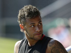 FILE - In this July 17, 2017, file photo, FC Barcelona's Neymar attends a training session in Sant Joan Despi, Spain. Neymar is not for sale, according to Barcelona President Josep Bartomeu. Speaking Thursday, July 20, 2017,  during an interview at The Associated Press, Bartomeu said: "He is not on the market." (AP Photo/Manu Fernandez, File)