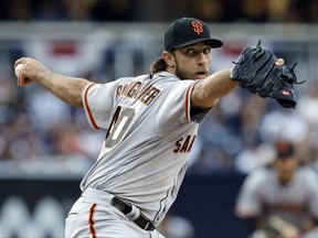 FILE - In this April 8, 2017, file photo, San Francisco Giants starting pitcher Madison Bumgarner throws to a San Diego Padres batter during the first inning of a baseball game in San Diego. Bumgarner returns to the mound Saturday for the first time since a dirt bike accident led to a sprained AC joint in his pitching shoulder and bruised ribs. (AP Photo/Alex Gallardo, File)