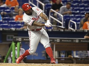 FILE - In this May 31, 2017, file photo, Philadelphia Phillies' Howie Kendrick hits a single against the Miami Marlins during a baseball game in Miami. Kendrick has been traded from the Phillies to the Washington Nationals for minor league pitcher McKenzie Mills. As part of the deal announced Friday night, July 28, the Phillies will send cash to the Nationals to cover part of the $3.55 million remaining in Kendrick's $10 million salary. (AP Photo/Lynne Sladky, File)