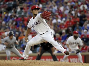 FILE - In this July 26, 2017, file photo, Texas Rangers' Yu Darvish throws to against the Miami Marlins in the fourth inning of a baseball game, in Arlington, Texas. As the hours tick down to baseball's trade deadline, three standout pitchers remain at the center of attention. Sonny Gray, Justin Verlander and Yu Darvish each have the potential to help a contending team down the stretch, and if any of them are traded Monday, July 31, 2017, it would certainly spice up what has been a fairly pedestrian stretch of deals so far. (AP Photo/Tony Gutierrez, File)