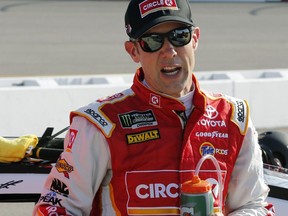 FILE - In this April 28, 2017, file photo, Matt Kenseth talks to one of his crew during qualifying for the NASCAR Cup Series auto race at Richmond International Raceway, in Richmond, Va. Kenseth said Friday, July 7, 2017, he has no job lined up next year and likely has no future at Joe Gibbs Racing. (AP Photo/Steve Helber, File)