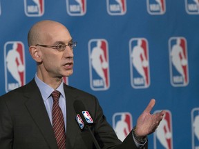 FILE - In this Oct. 21, 2016, file photo, NBA Commissioner Adam Silver speaks to reporters during a news conference, in New York. The NBA is trying to make games go a little more quickly. The league's Board of Governors has unanimously approved some changes that will potentially eliminate four time-outs per game, help speed up the final minutes of games and emphasize a timely resumption of play after halftime. (AP Photo/Mary Altaffer, File)