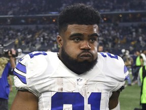 FILE - In this Jan. 15, 2017, file photo, Dallas Cowboys' Ezekiel Elliott (21) walks off the field after  a 34-31 loss to the Green Bay Packers in an NFL divisional playoff football game, in Arlington, Texas. Cowboys owner Jerry Jones says the club is still gathering details over Elliott's involvement in an altercation at a Dallas bar, the latest off-field incident for the star running back.  (AP Photo/Michael Ainsworth, File)