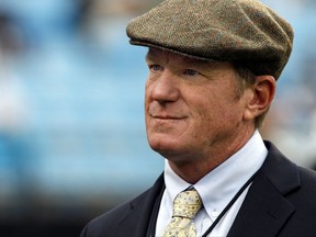 FILE - This Oct. 7, 2012, file photo shows Carolina Panthers general manager Marty Hurney watching the Panthers warm up before an NFL football game against the Seattle Seahawks, in Charlotte, N.C. The Panthers have turned to a familiar face to run their front office and bring some stability to the organization. Carolina rehired Marty Hurney as their interim general manager on Wednesday, July 19, 2017, two days after owner Jerry Richardson surprisingly fired Dave Gettleman. (AP Photo/Nell Redmond, File)