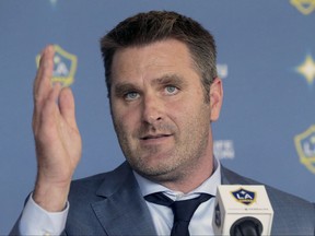 File-This Dec. 13, 2016, file photo shows Curt Onalfo being introduced as the new head coach of the Los Angeles Galaxy soccer team at news conference in Carson, Calif. The Galaxy fired Onalfo Thursday, July 27, 2017,  just 20 games into his first season. The Galaxy hired veteran MLS coach Sigi Schmid to return to the struggling club. (AP Photo/Nick Ut, File)