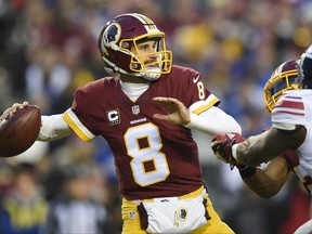 FILE - In this Jan. 1, 2017, file photo, Washington Redskins quarterback Kirk Cousins (8) passes during the first half of an NFL football game against the New York Giants, in Landover, Md. Cousins is expected to play a second consecutive season on the franchise tag unless his camp and the Washington Redskins surprisingly reach a last-minute agreement on a long-term contract. (AP Photo/Nick Wass, File)